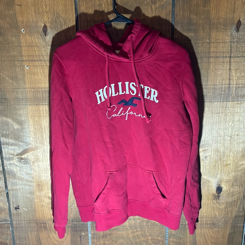 Hollister red hoodie with graphics size large